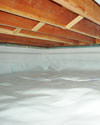 a moisture barrier installed on the walls and floors of a crawl space in Spring Lake